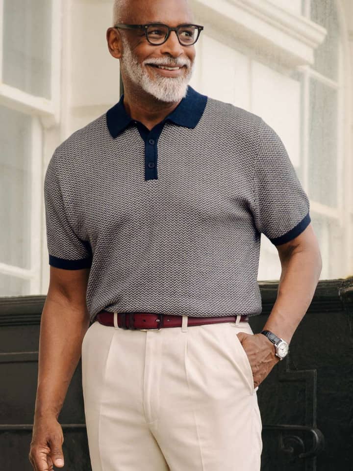 Model wears Navy & Stone Knitted Polo Shirt