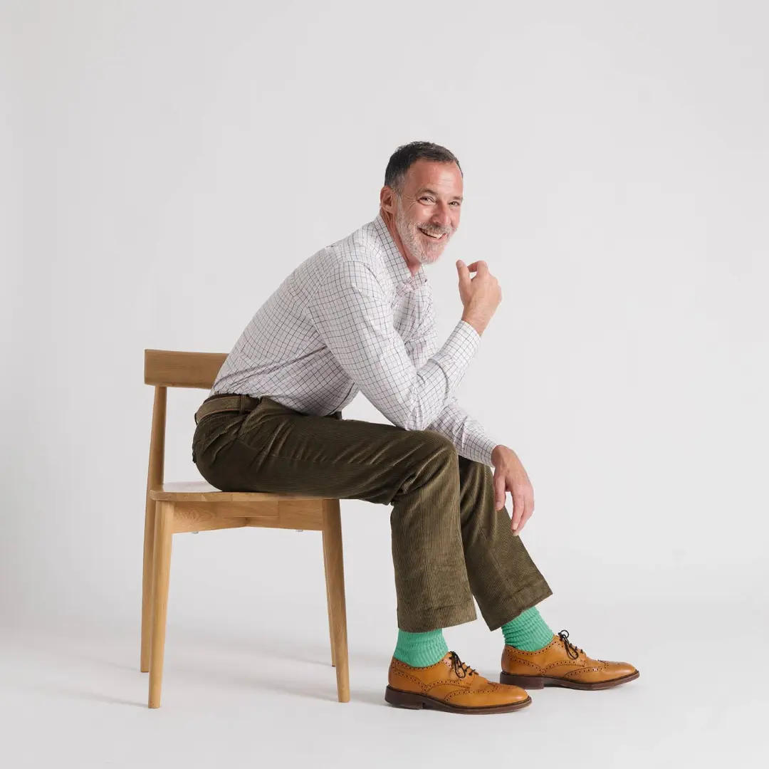 mens-moss-green-corduroy-trousers-model.webp