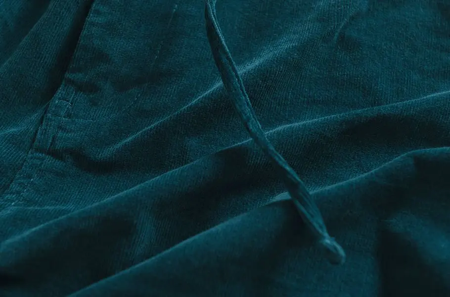 mens-blue-corduroy-drawstring-trousers-fabric.webp
